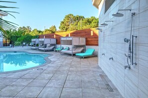 Outdoor pool, open 9:00 AM to 10:00 PM, free cabanas, pool umbrellas