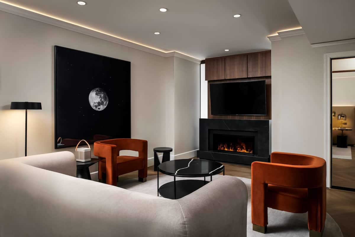 Suite, 1 King Bed | Living area | 55-inch flat-screen TV with cable channels, TV, iPod dock