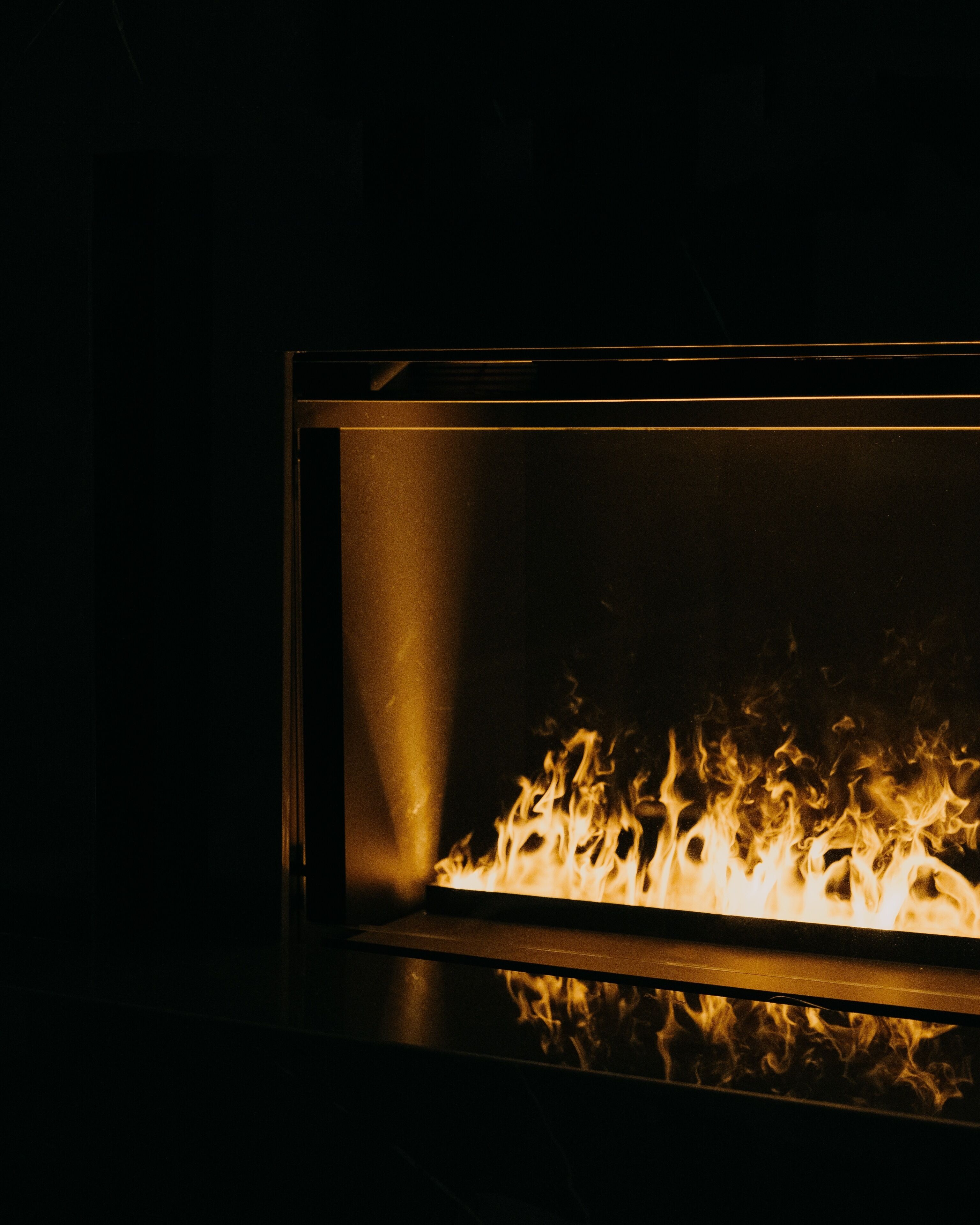 A fireplace with visible flames.