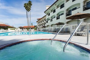 Outdoor pool, open 7:00 AM to 11:00 PM, pool umbrellas, pool loungers