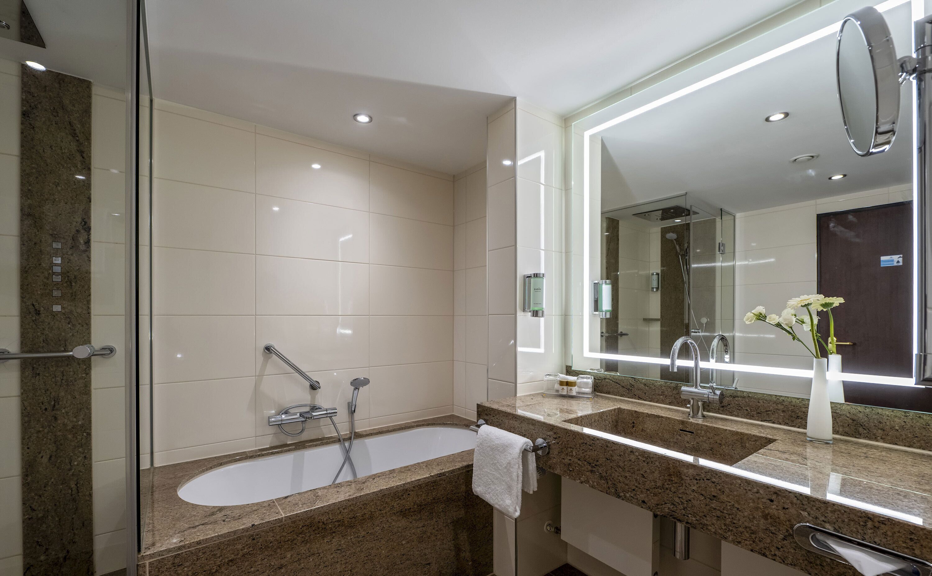 junior suite | bathroom | rainfall showerhead, free toiletries, hair dryer, towels