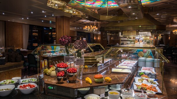 A buffet area with various food options and a bar in the background. - Maritim Hotel Bremen (Bremen)