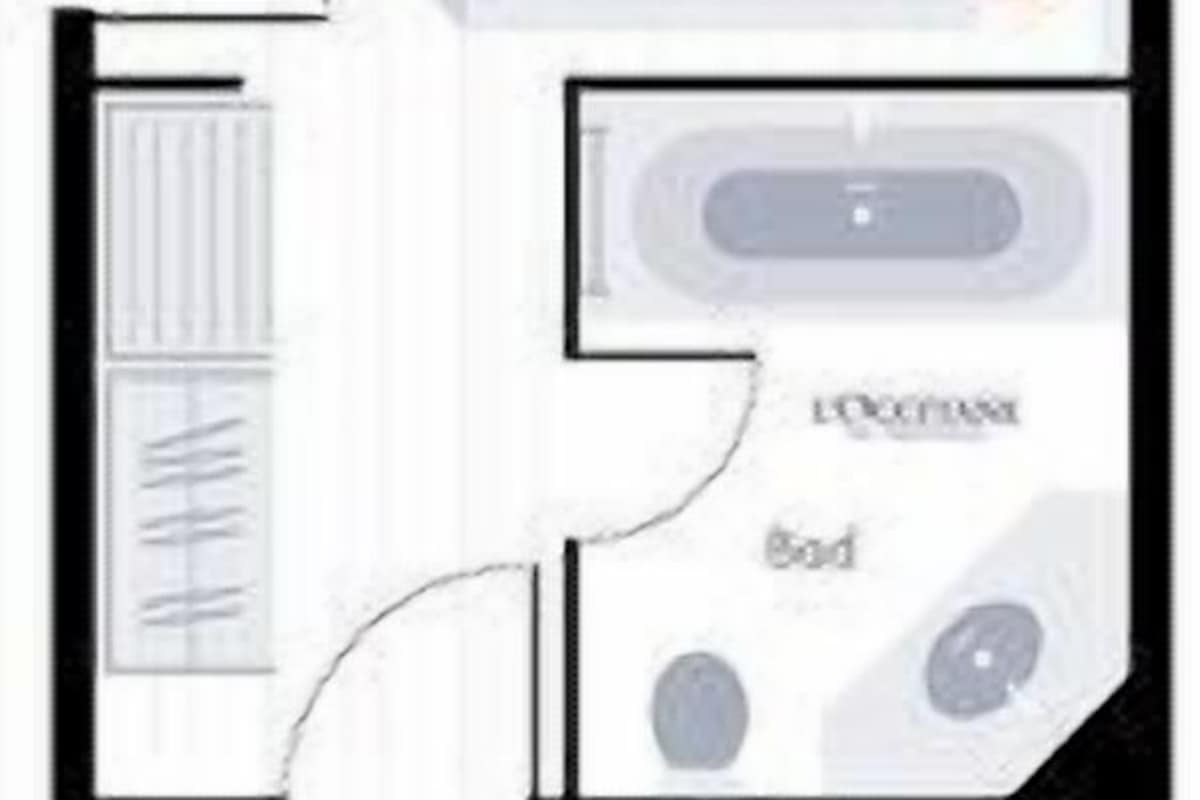 Plano de planta que muestra una sala de estar, cocina, baño y un pequeño balcón.