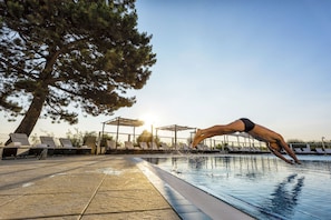 Indoor pool, outdoor pool, pool umbrellas, pool loungers