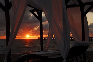 On the beach, sun loungers, beach towels