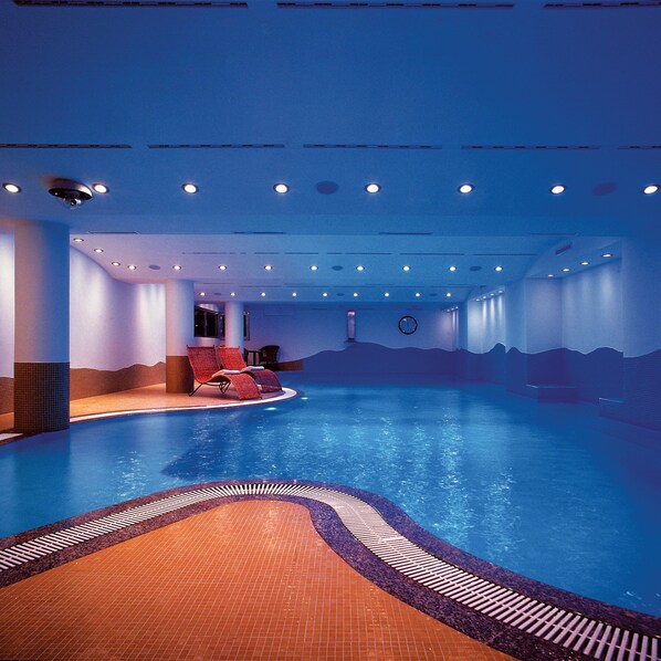 Indoor pool, pool umbrellas, sun loungers