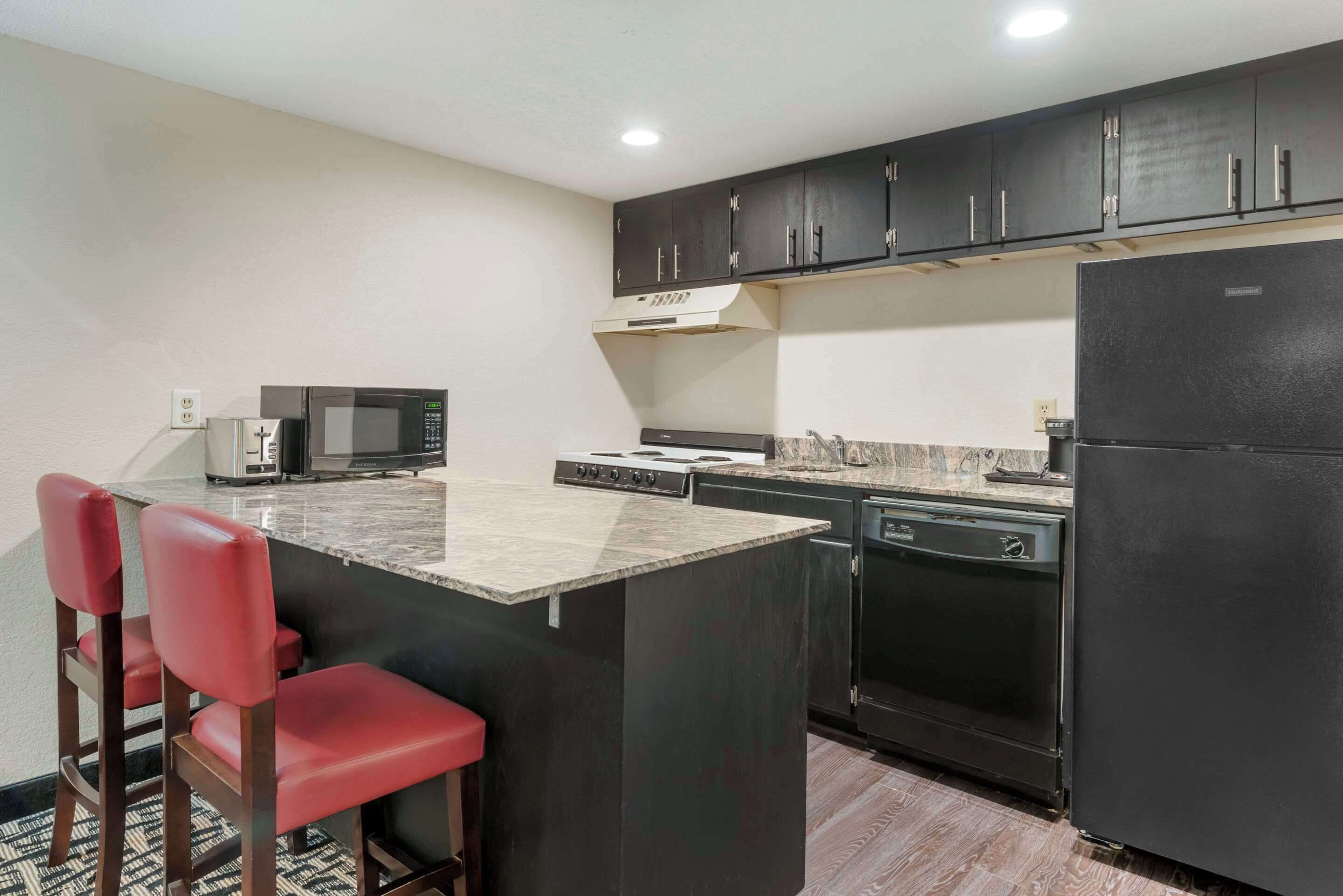 family suite, 2 queen beds | private kitchen | fridge, microwave, coffee/tea maker