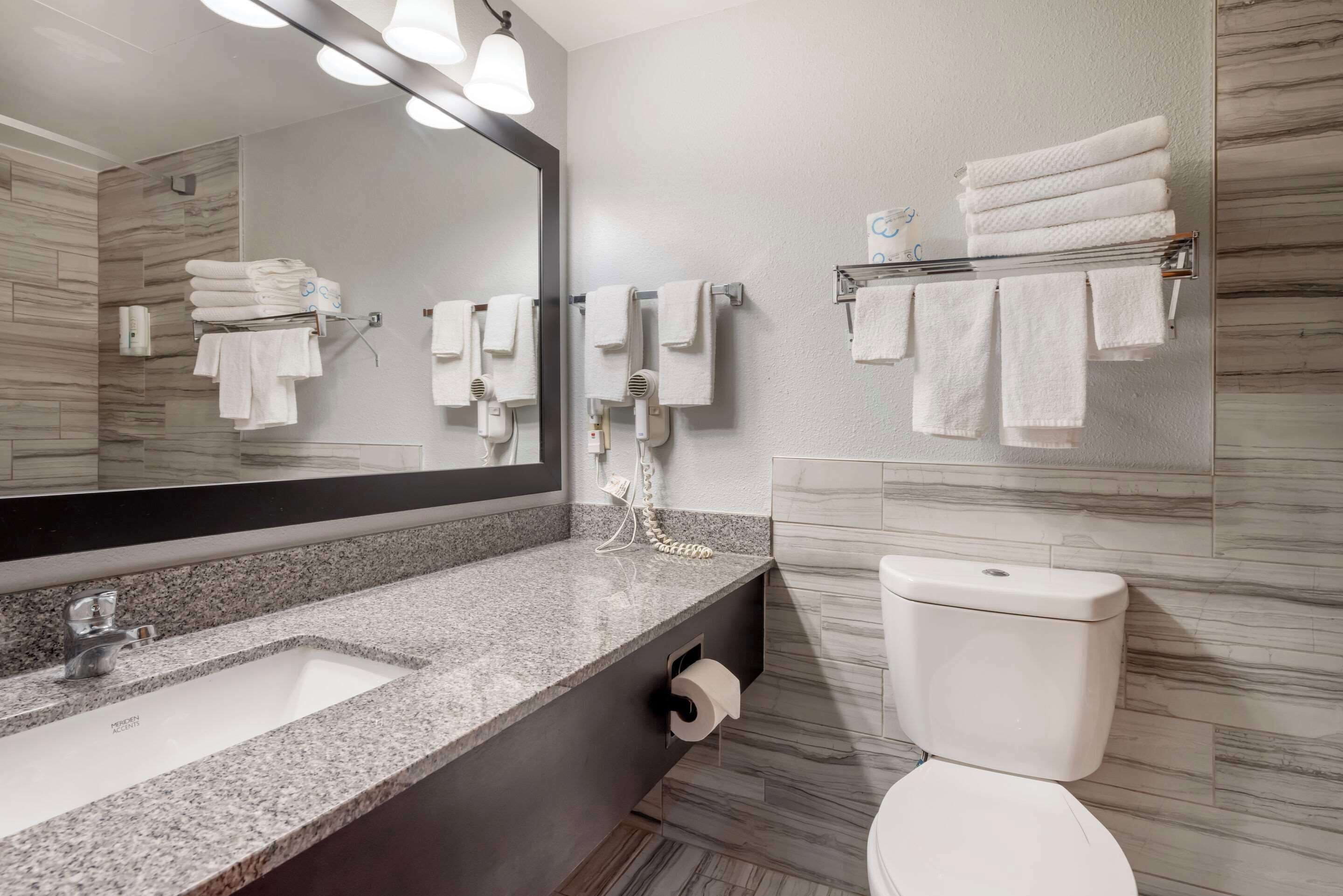 family suite, 2 queen beds | bathroom | hair dryer, towels