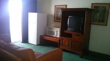 Deluxe Suite, 1 Double Bed | Living area | TV