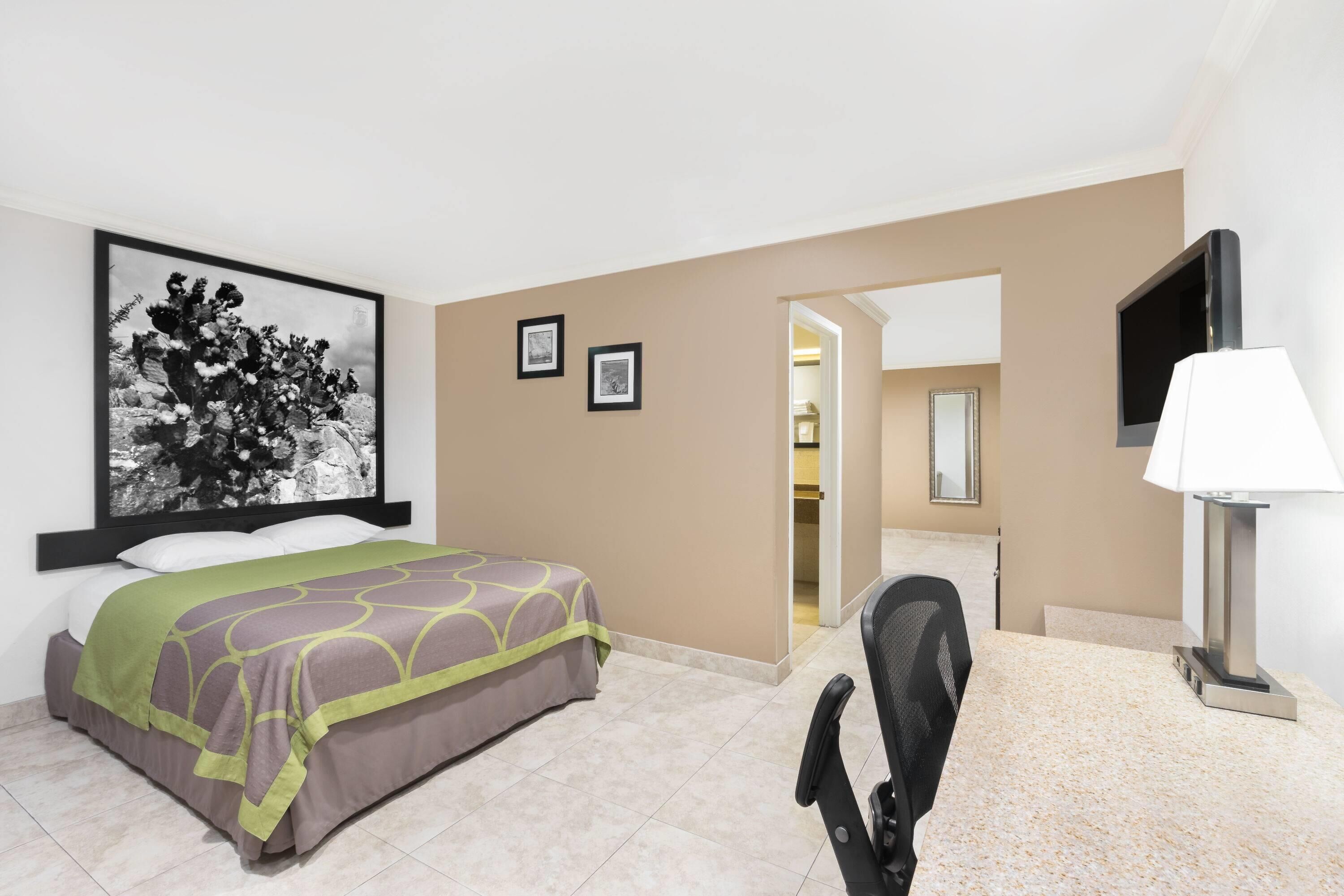 Suite (1 King and 1 Queen bed) | Desk, iron/ironing board (on request), WiFi (free), bed sheets