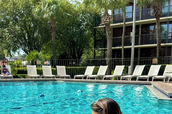 Outdoor pool, open 9:00 AM to 10:00 PM, pool umbrellas, sun loungers