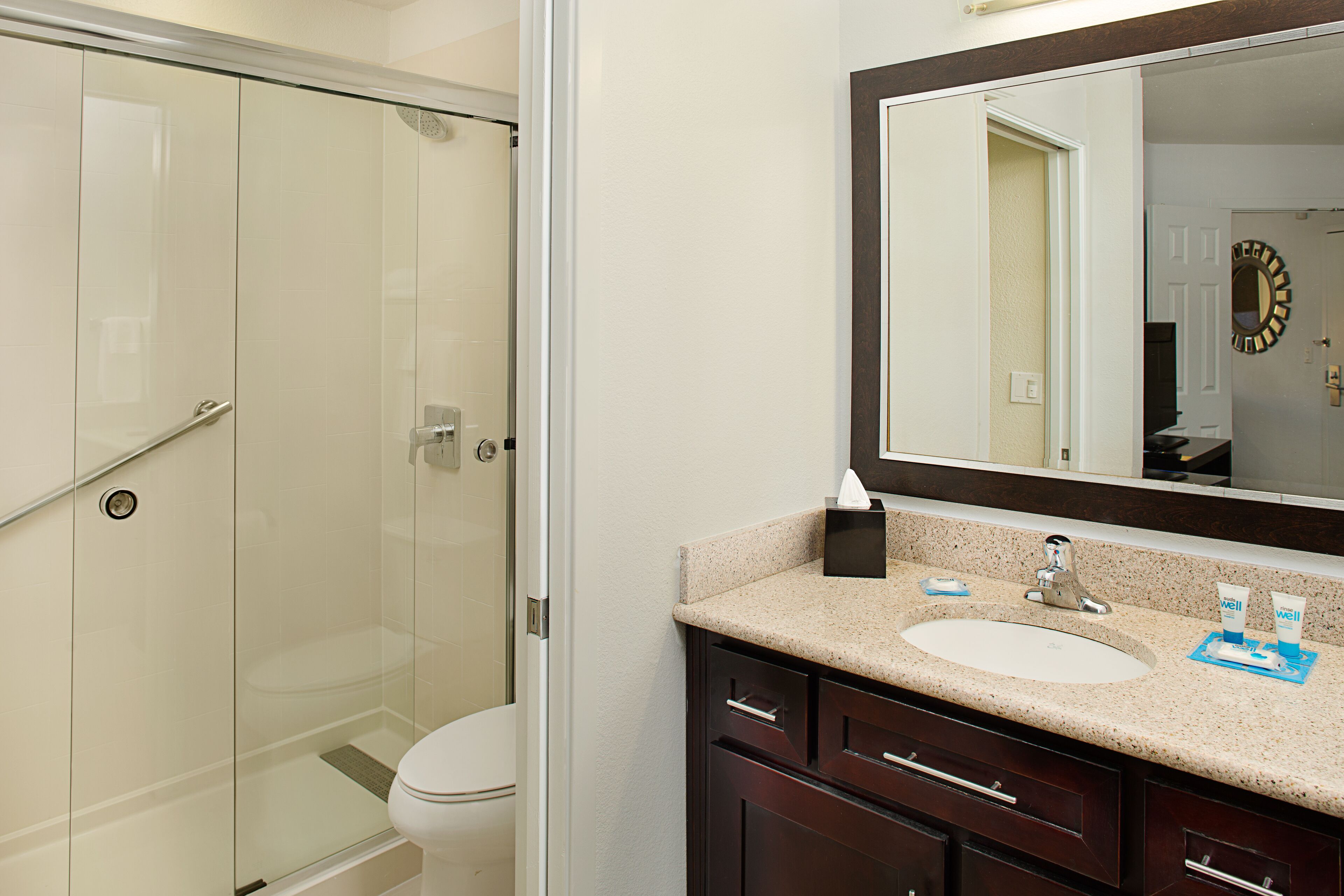 designer toiletries, hair dryer, towels, soap