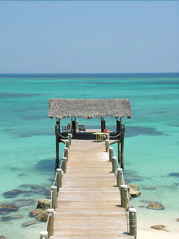 Beach nearby, white sand, sun loungers, beach towels