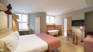 Superior kamer | Luxe beddengoed, een minibar, een kluis op de kamer