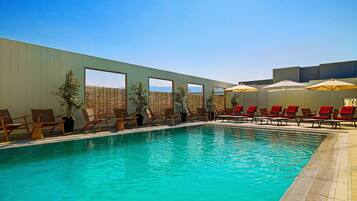 Seasonal outdoor pool, open 10:00 AM to 6:30 PM, lifeguards on site