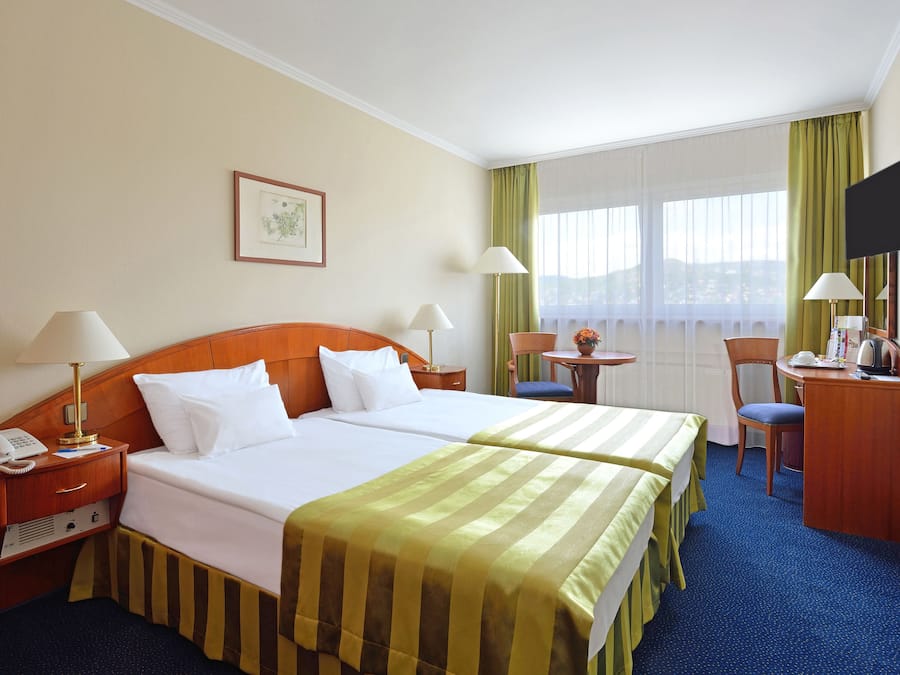 Hypo-allergenic bedding, down duvets, in-room safe, desk