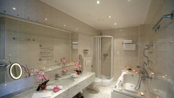 Separate tub and shower, hair dryer, bathrobes, slippers