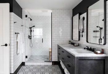 Room (The Roosevelt Suite) | Bathroom | Shower, rainfall showerhead, designer toiletries, hair dryer at Hotel Theodore Seattle Downtown, Tapestry by Hilton
