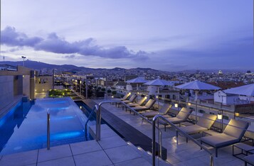 Seasonal outdoor pool, pool loungers