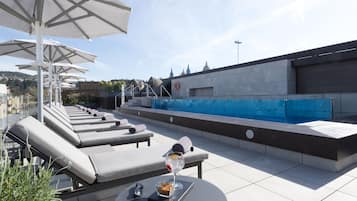 Seasonal outdoor pool, pool loungers