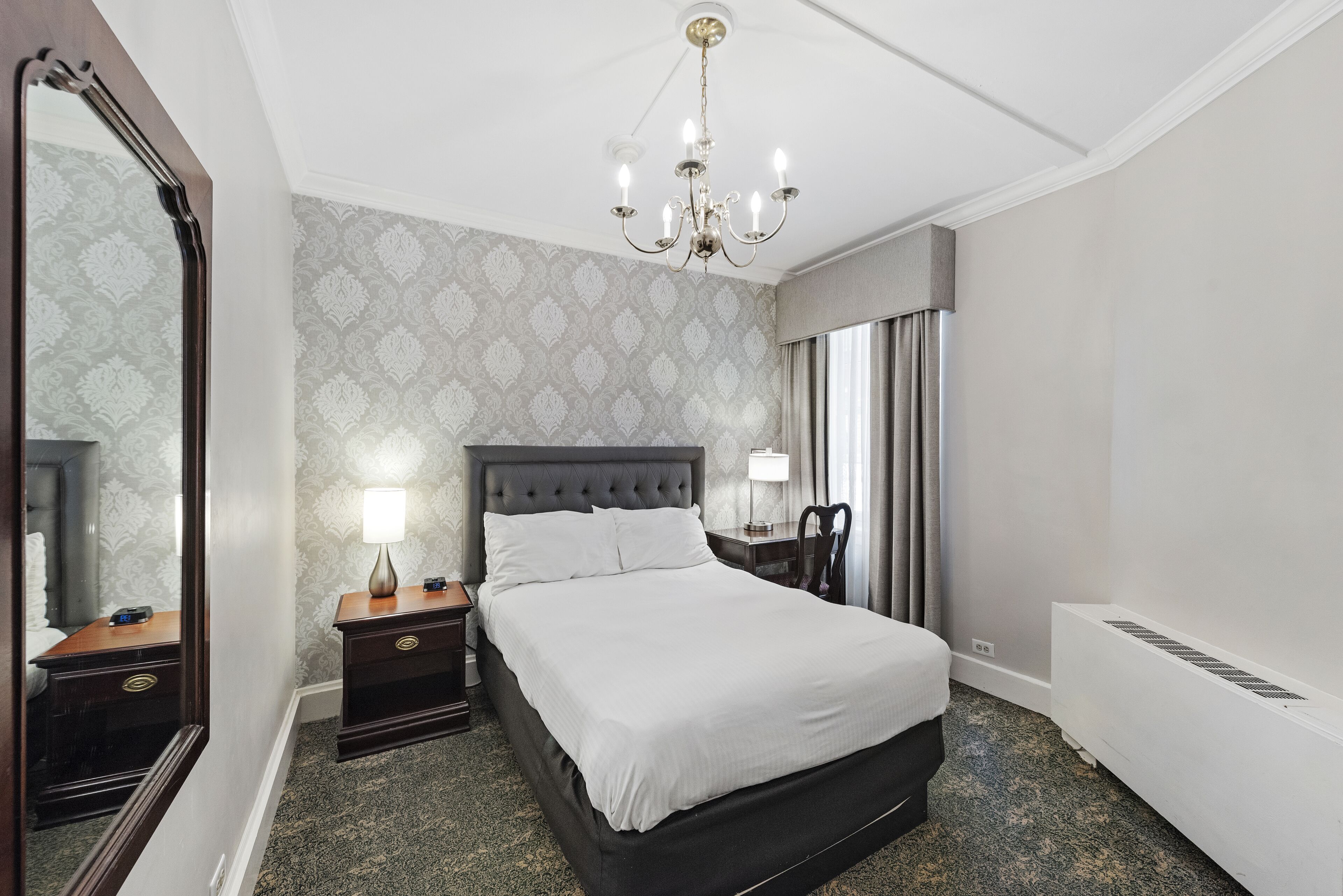 economy room | 1 bedroom, desk, blackout curtains, iron/ironing board