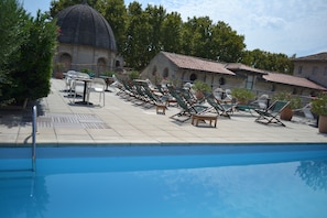 Seasonal outdoor pool, pool umbrellas, pool loungers