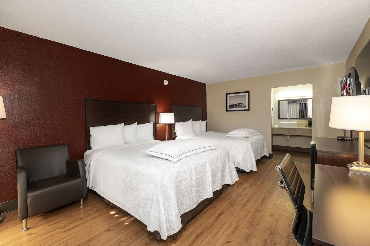 Premium Room, 2 Queen Beds (Upgraded Bedding & Snack, Smoke Free) | Desk, laptop workspace, blackout drapes, iron/ironing board