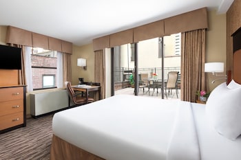 Hotel amenities such as safe, desk and work area at The Hotel @ Fifth Avenue