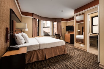 Hotel amenities such as safe, desk and work area at The Hotel @ Fifth Avenue