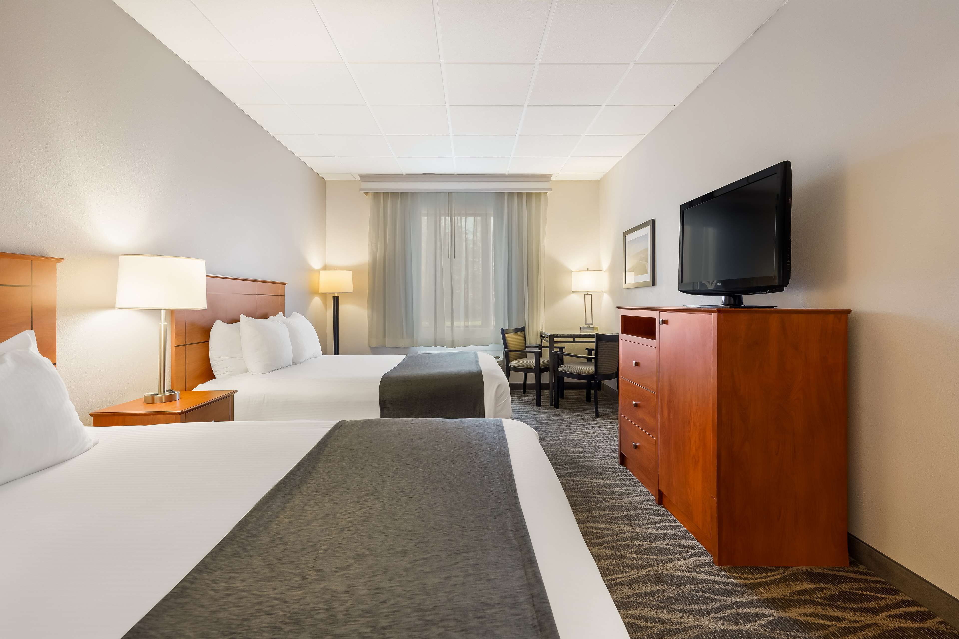 standard room, 2 queen beds, non smoking, refrigerator & microwave | laptop workspace, iron/ironing board, free cots/infant beds