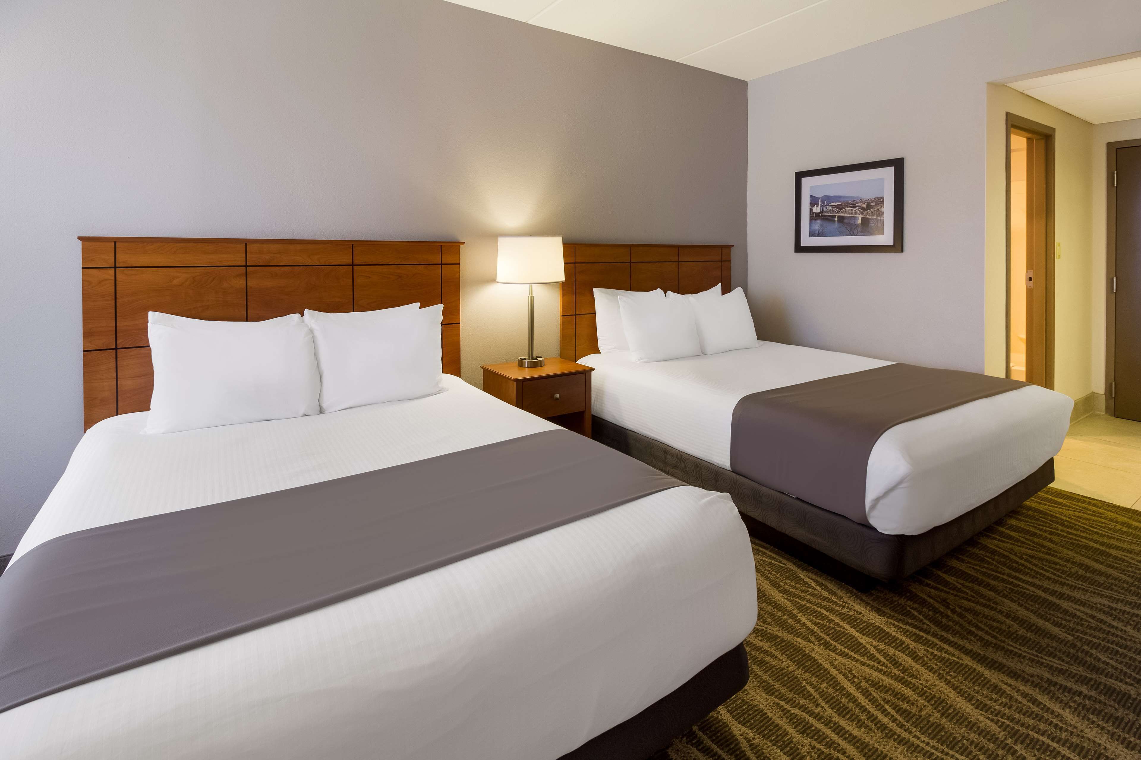 standard room, 2 queen beds, non smoking, refrigerator & microwave | laptop workspace, iron/ironing board, free cots/infant beds