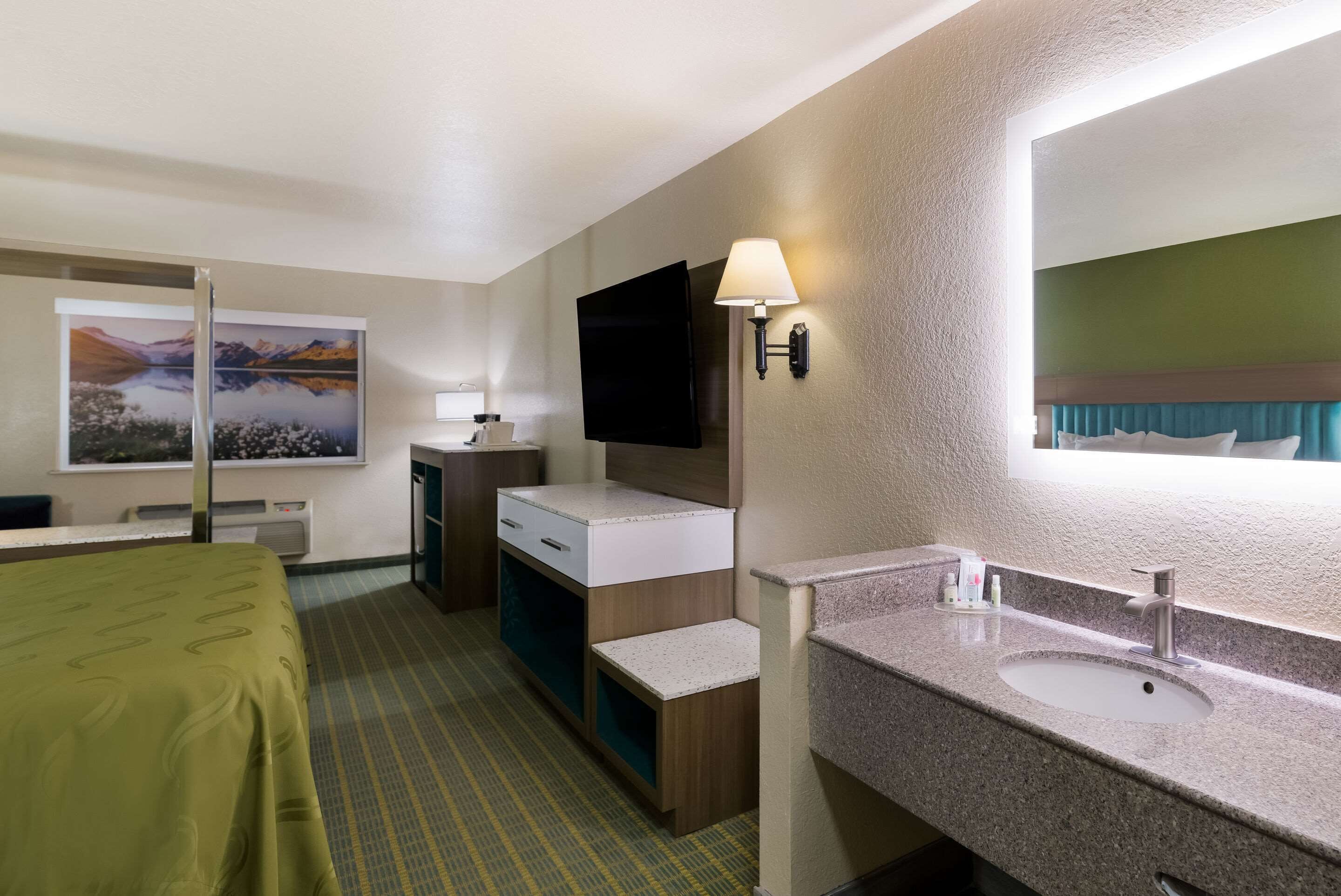 pillow-top beds, desk, laptop workspace, blackout curtains