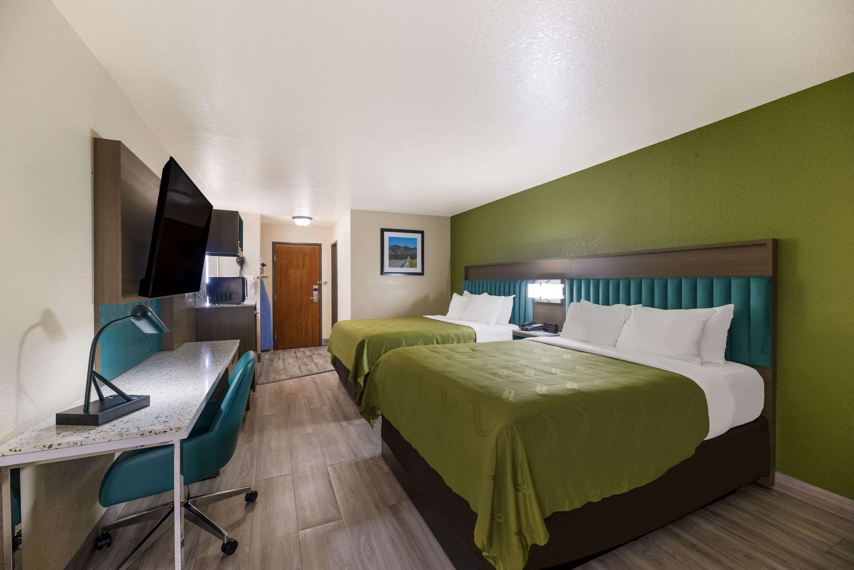 pillow-top beds, desk, laptop workspace, blackout curtains