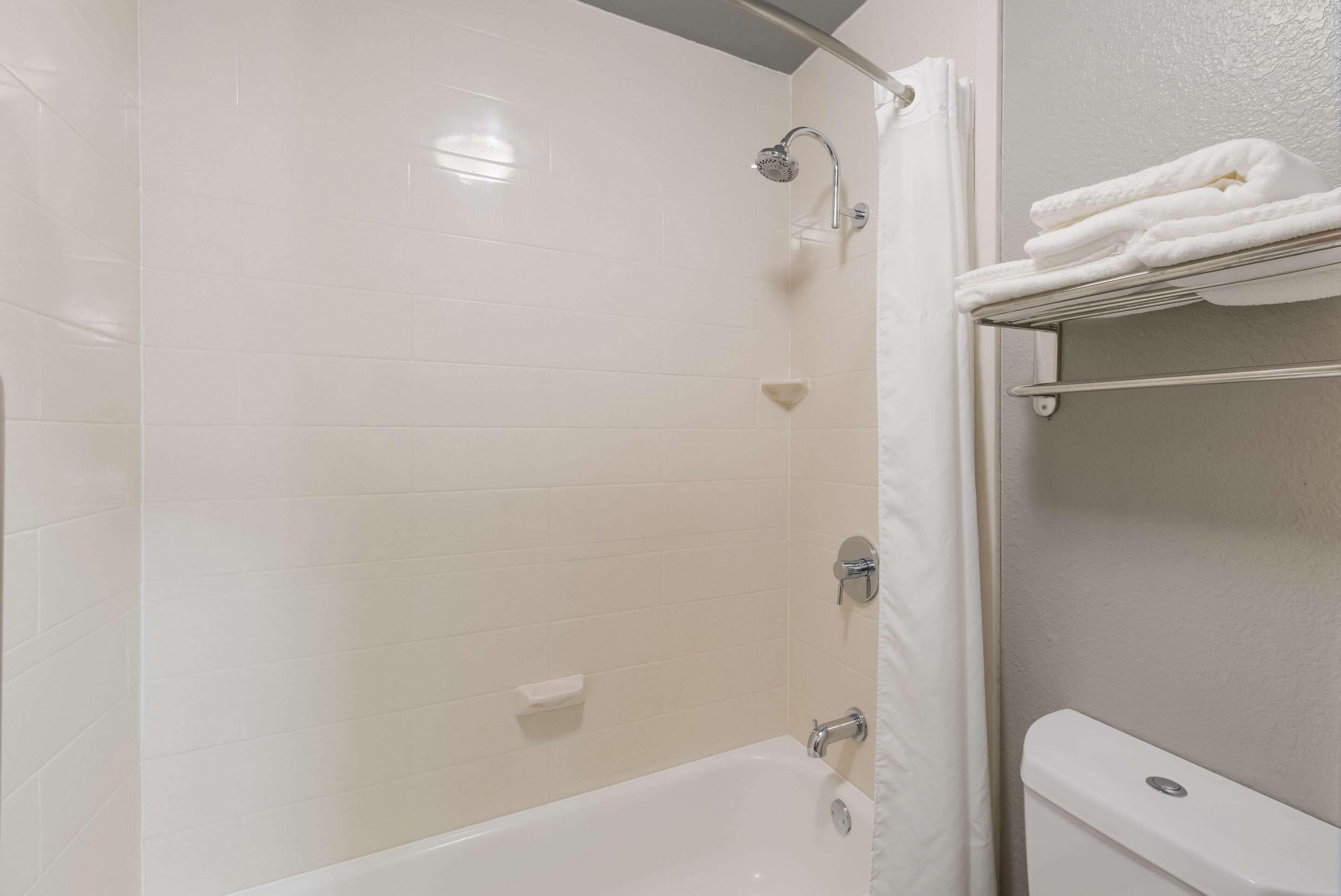 pillow-top beds, desk, laptop workspace, blackout curtains