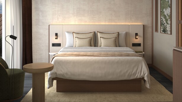 Un dormitorio moderno con una cama grande, lámparas de noche, una mesita redonda y vistas al exterior.