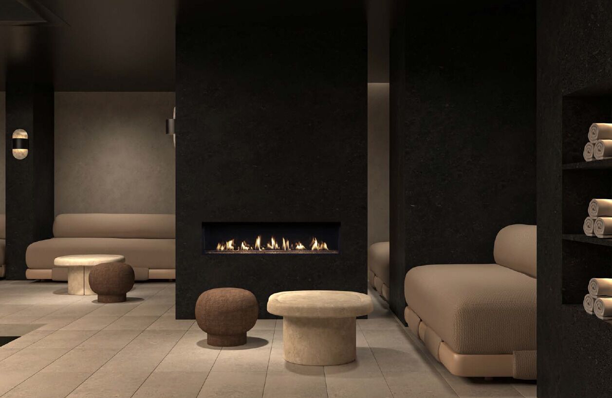 A modern interior with a fireplace, sofas, and a small table.