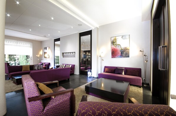 Relax in style with a comfortable sectional sofa and matching armchairs, perfect for social gatherings.