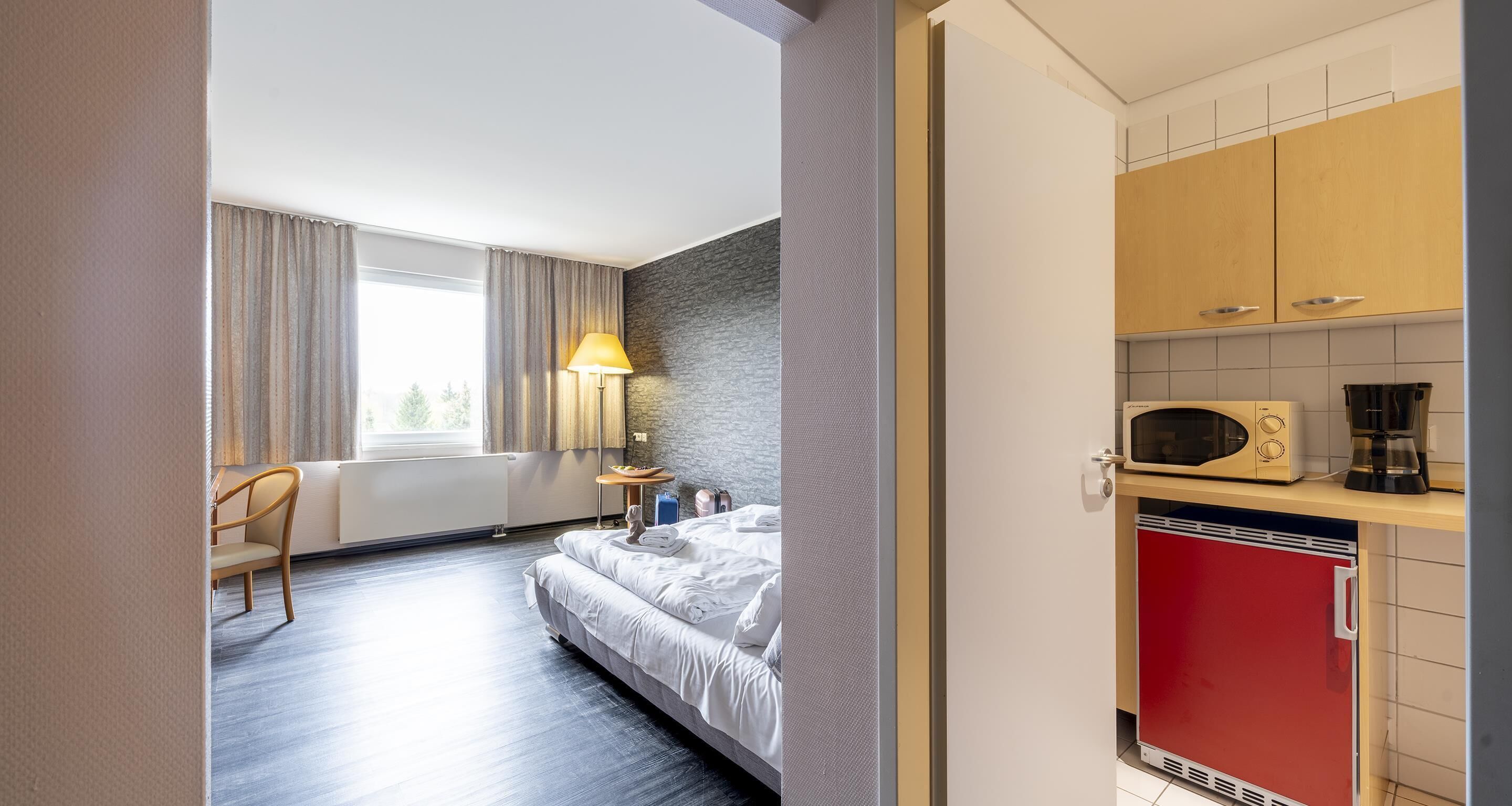 junior suite, 1 king bed, kitchenette (with sofabed) | minibar, in-room safe, individually decorated, individually furnished