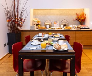 A breakfast buffet with various food items and a coffee station. - Best Western Hotel Major (Milan)