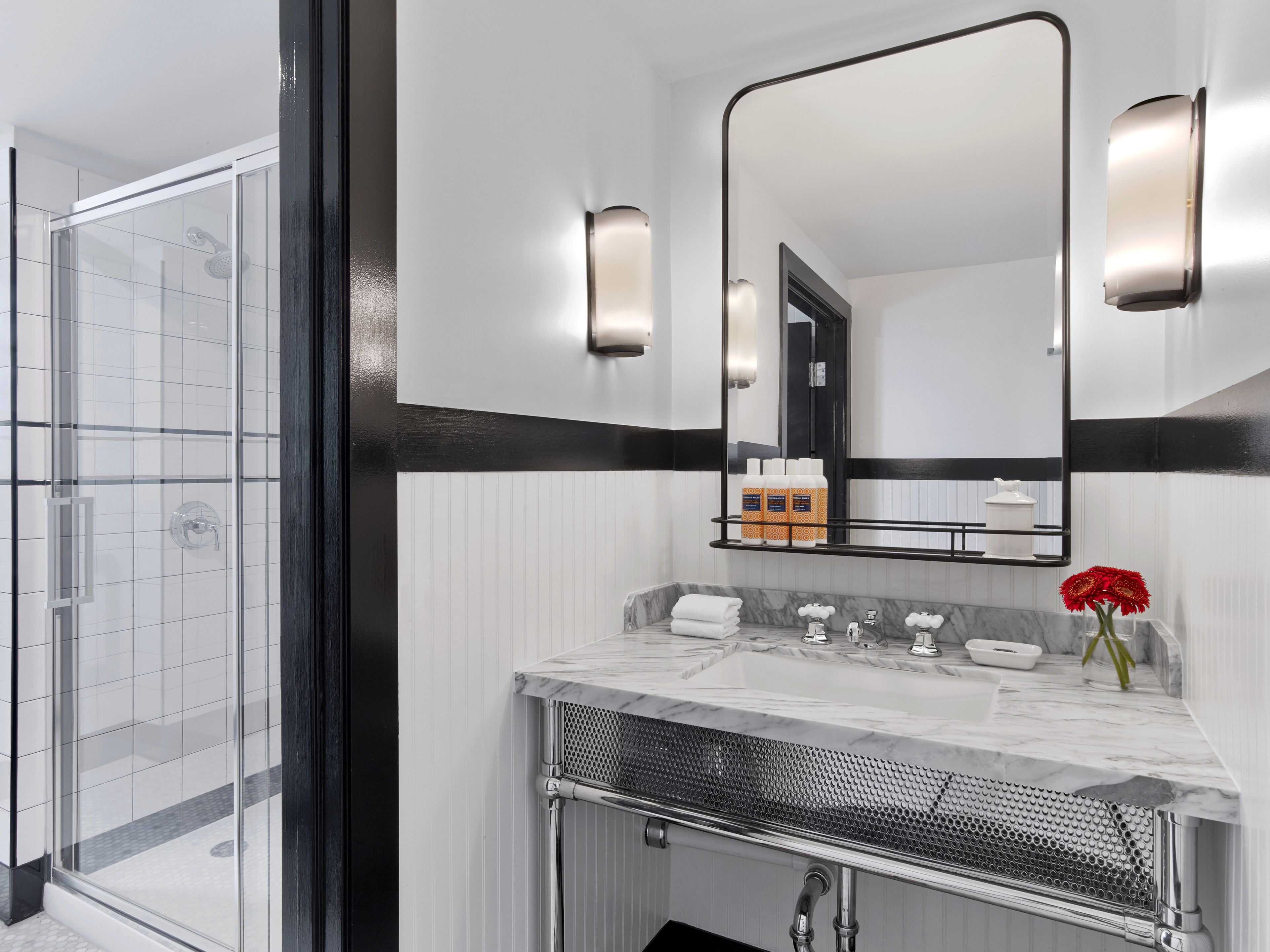 combined shower/bathtub, designer toiletries, hair dryer, slippers