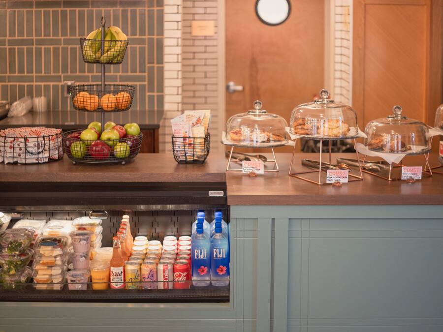 A breakfast buffet with various food items and beverages.