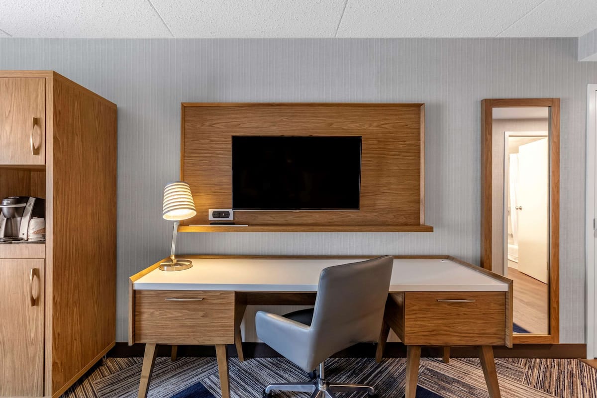 premium bedding, desk, blackout curtains, iron/ironing board