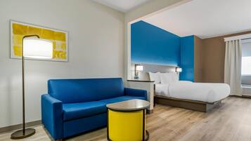 Suite, 1 King Bed with Sofa bed, Non Smoking, Jetted Tub | Desk, laptop workspace, iron/ironing board, free WiFi