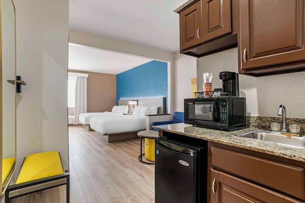 Suite, 2 Queen Beds, Non Smoking | Desk, laptop workspace, iron/ironing board, free WiFi