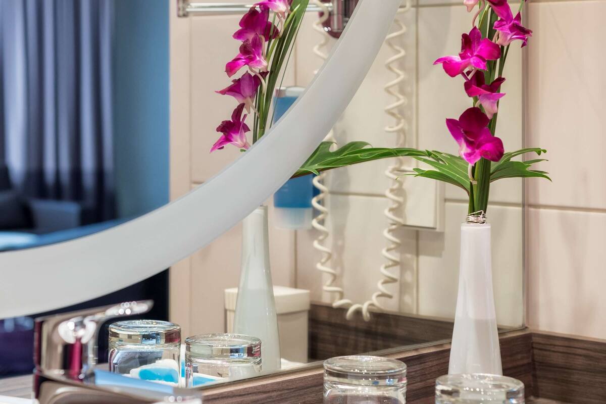 shower, eco-friendly toiletries, hair dryer, towels