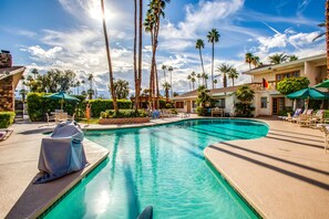 Outdoor pool, a heated pool, pool umbrellas, pool loungers
