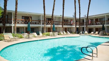 Outdoor pool, a heated pool, pool umbrellas, pool loungers