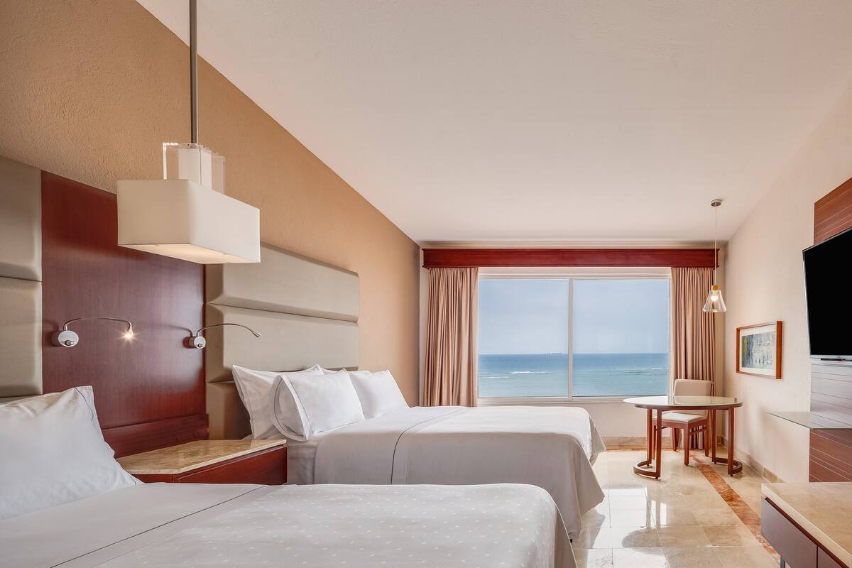 Premium bedding, down comforters, pillowtop beds, minibar