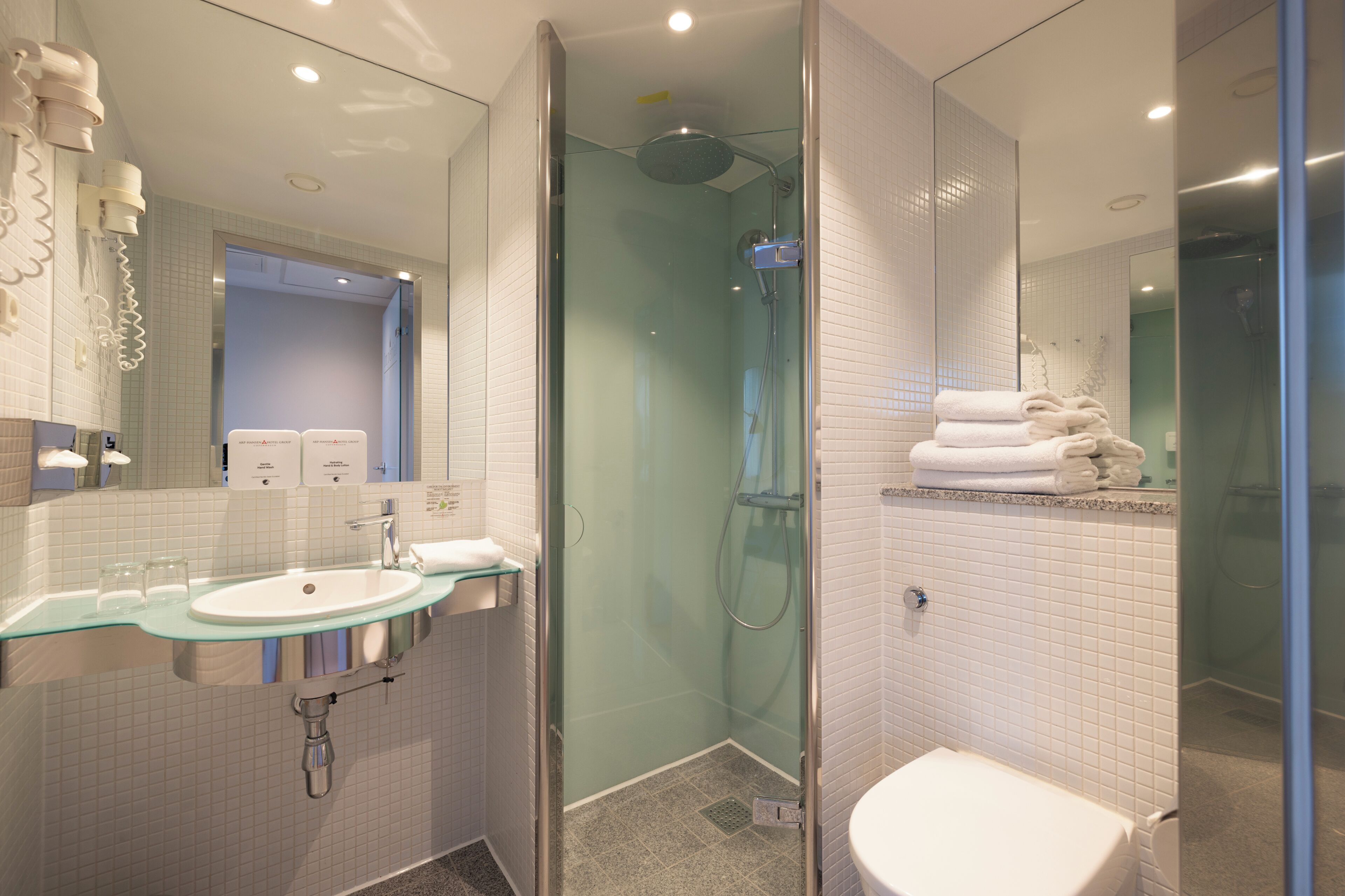 free toiletries, hair dryer, heated floors, towels