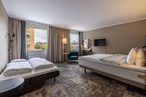 Family room | Hypo-allergenic bedding, down comforters, in-room safe, desk